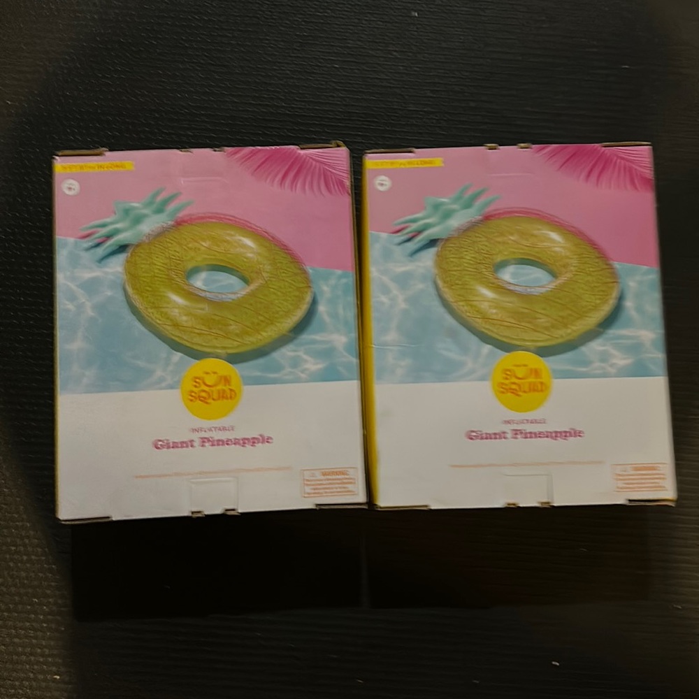 COPY - Two sun squad inflatable giant pineapple rafts.